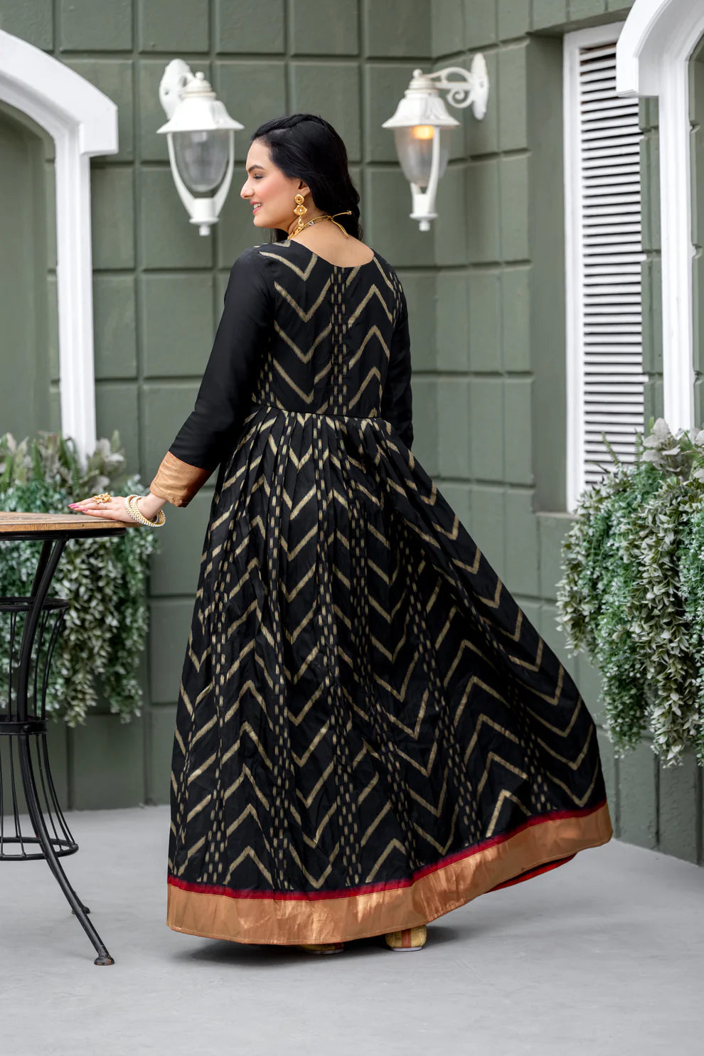 Dixz Fashion Chevron Zari-Woven Black Gown with Pleated Yoke & Zari Border Panel
